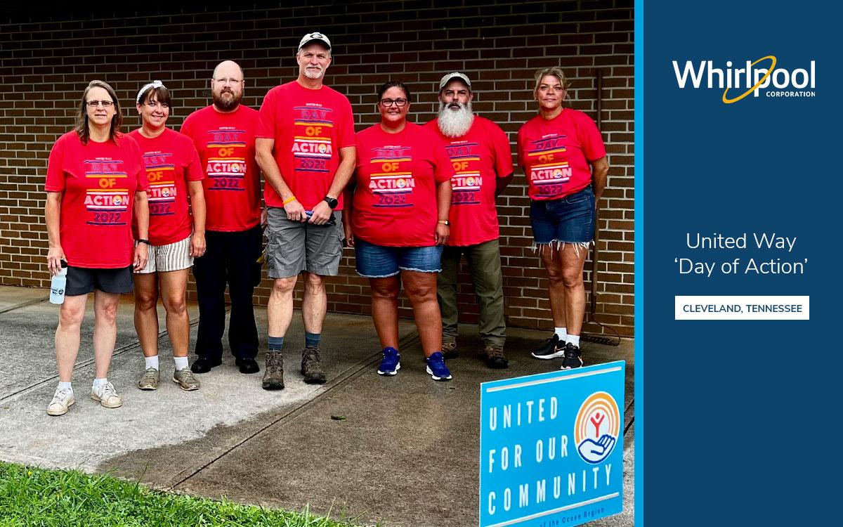 a group of seven people all wearing "day of action" t shirts. Whirlpool logo and United Way logo on the right