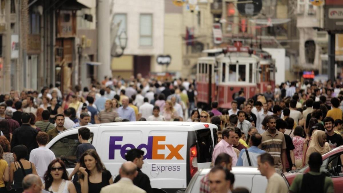 FedEx truck in busy streets
