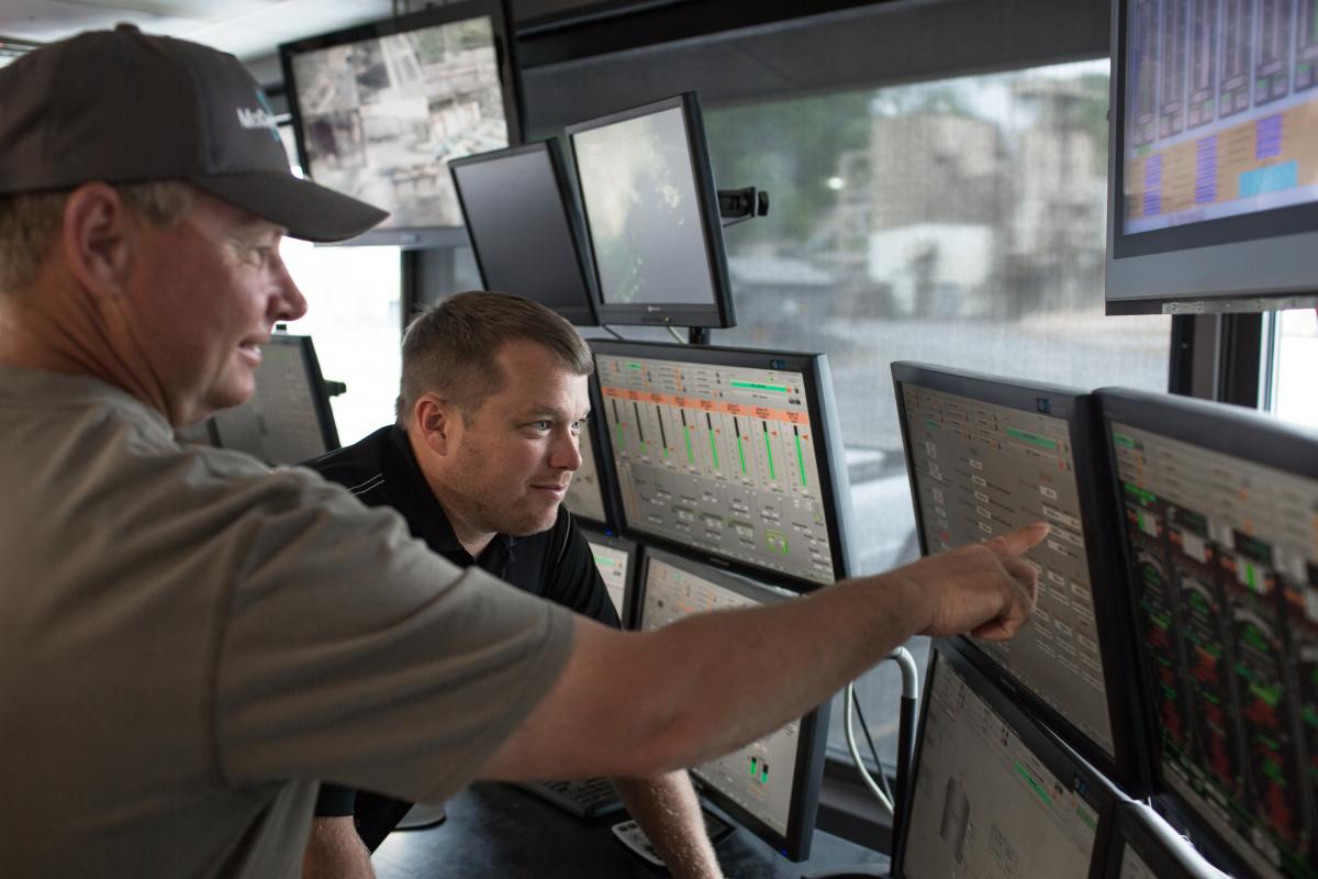 Clint Collins and Scott Lund, Boiler/By-Products Operator, evaluating the status of our spent stillage tanks and planning operations of our By-Products facility.