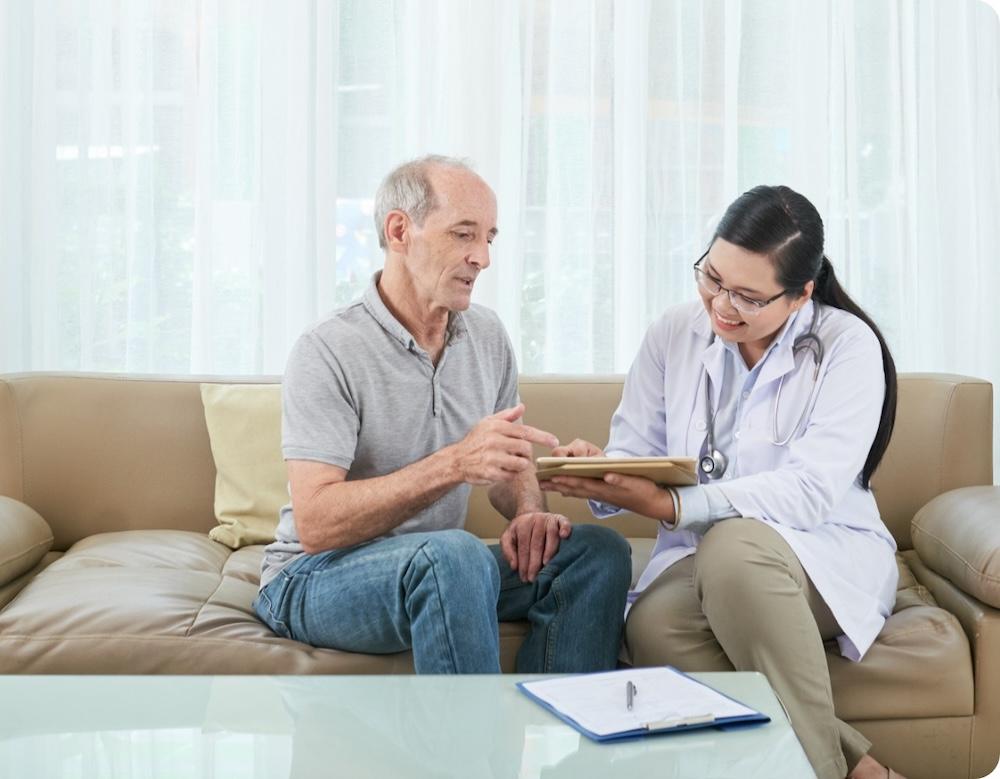 Female medical professional consulting with a male patient.