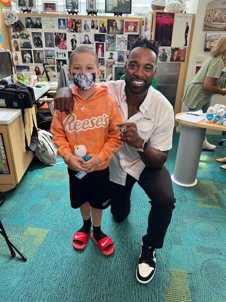 Colton Hall, 9, who was diagnosed with leukemia, gets a visit from former NFL star Calvin Johnson at Aflac Cancer and Blood Disorders Center in Atlanta Sept. 1. Courtesy The Hall Family
