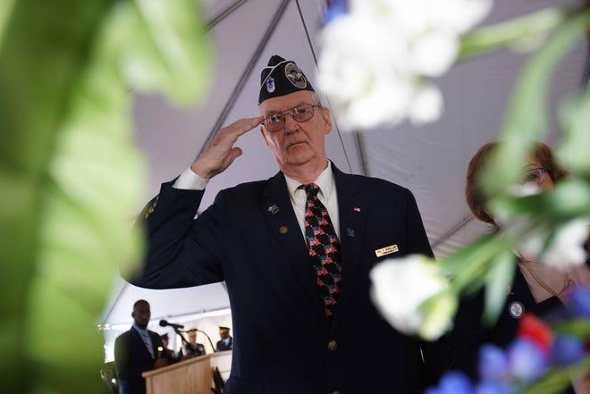 Veterans give a salute to honor those who served during the annual Veterans Day Ceremony at the Delaware Memorial Bridge Veterans Memorial Park on Monday morning. Jennifer Corbett, Delaware News Journal