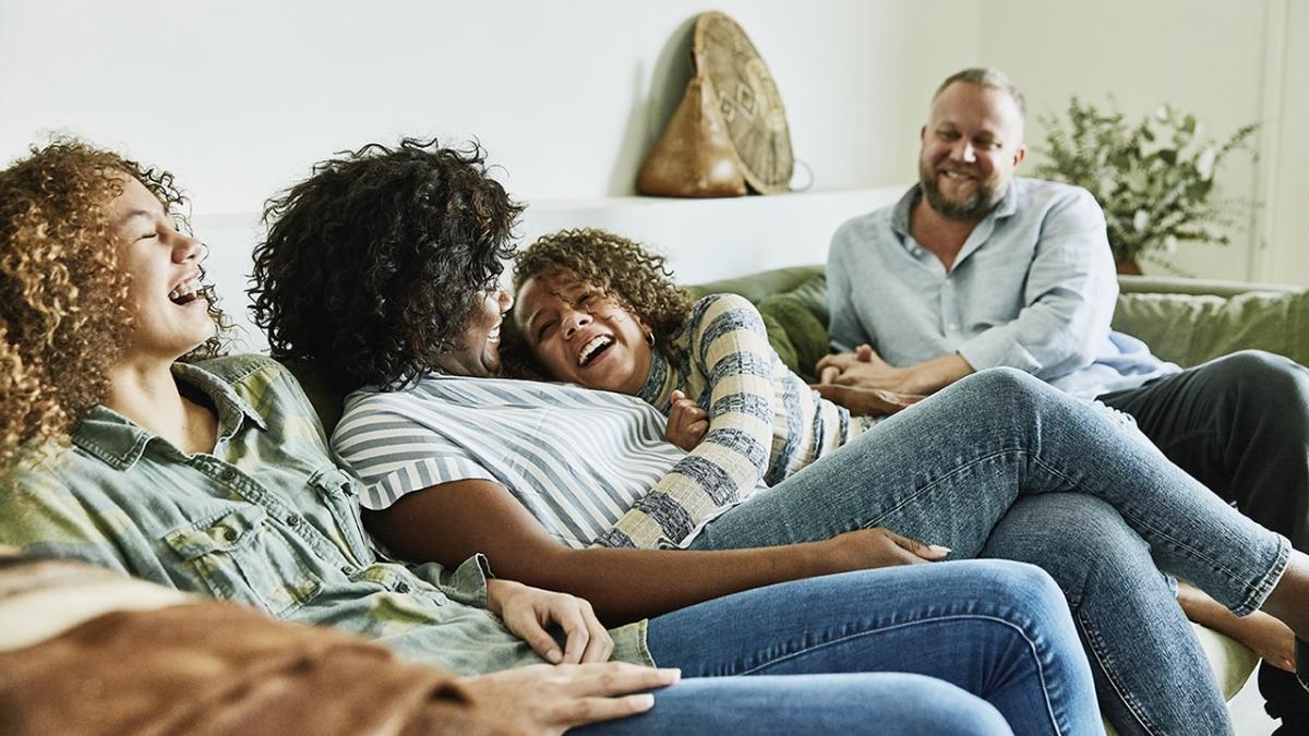 Group of four people seated on a couch.