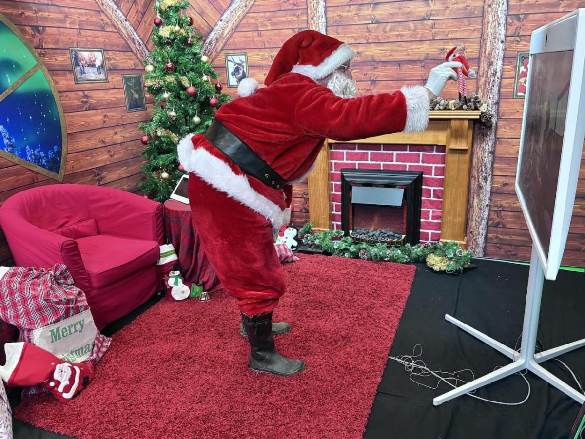 Santa waving at large screen