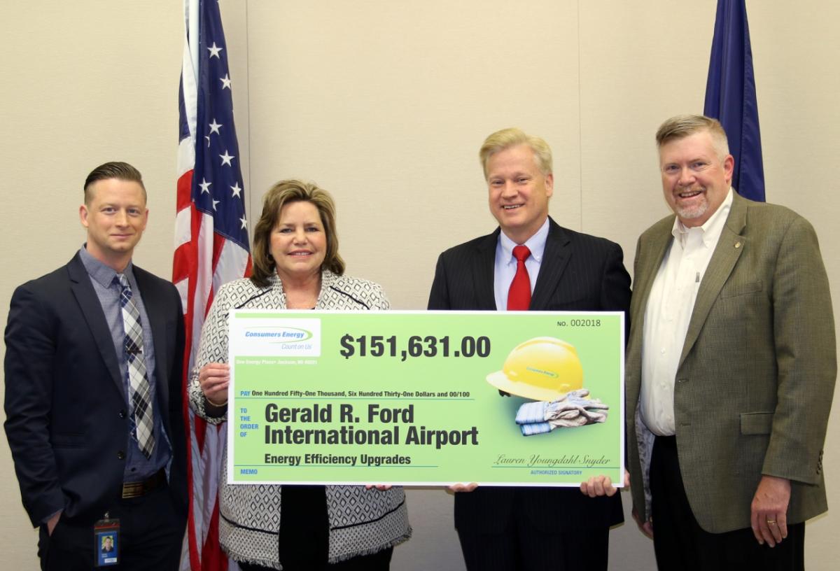 Above: (L-R) David Zokoe and Lisa Gustafson from Consumers Energy, present GFIAA Board Chairman Dan Koorndyk, and Consumers Energy Senior Public Information Director Roger Morgenstern with an energy-efficiency incentive check.
