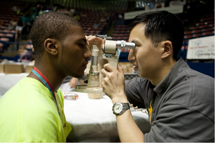 Man performing eye exam 