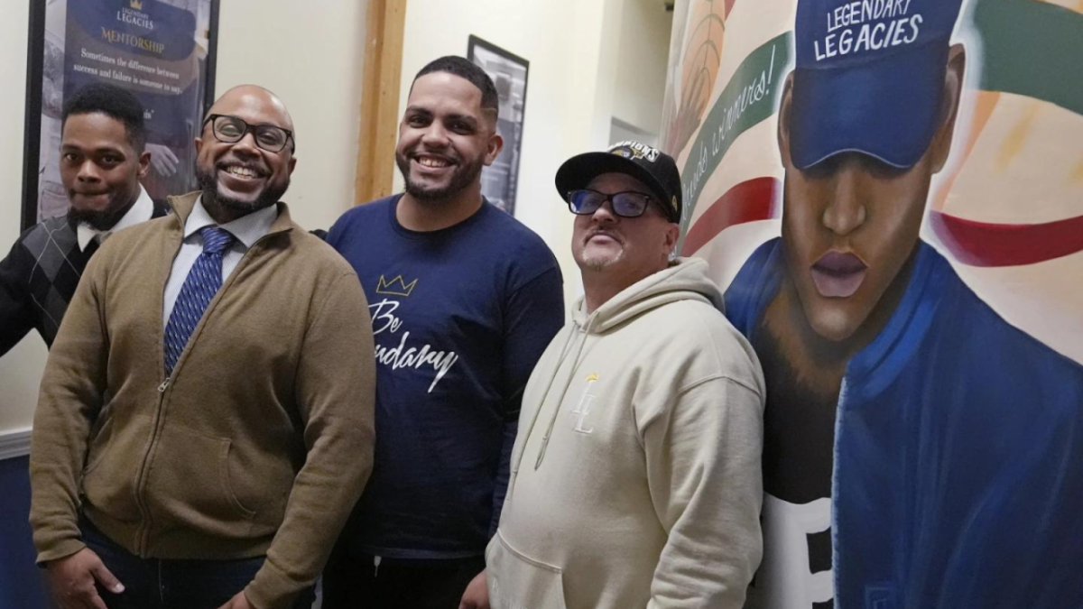 Ron Waddell, founder of Legendary Legacies, poses with men who benefit from his nonprofit organization. 