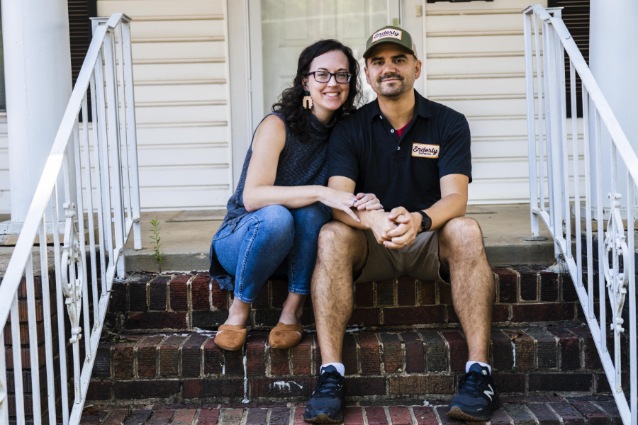 The santoros on a brick porch.