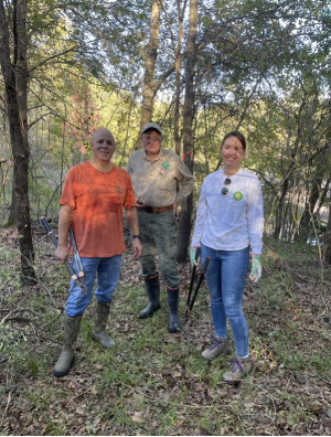 three people in the forest