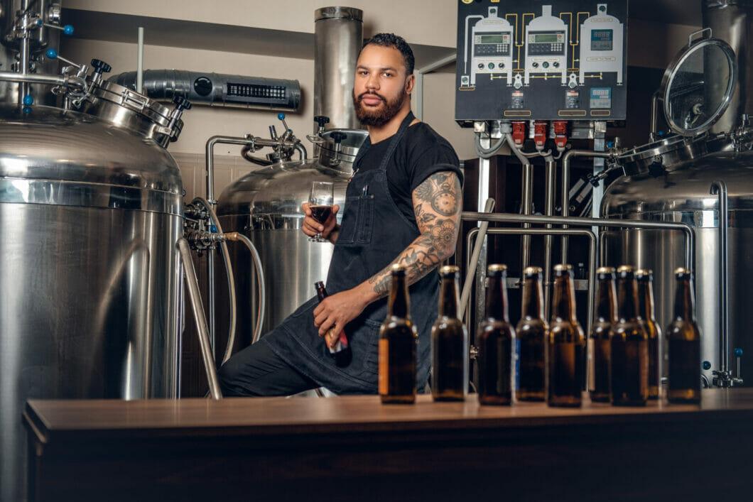 PHOTO 113067041 | CRAFT BEER © VLADIMIRS POPLAVSKIS | DREAMSTIME.COM Photo of bartender behind a craft beer bar, looking into the camera