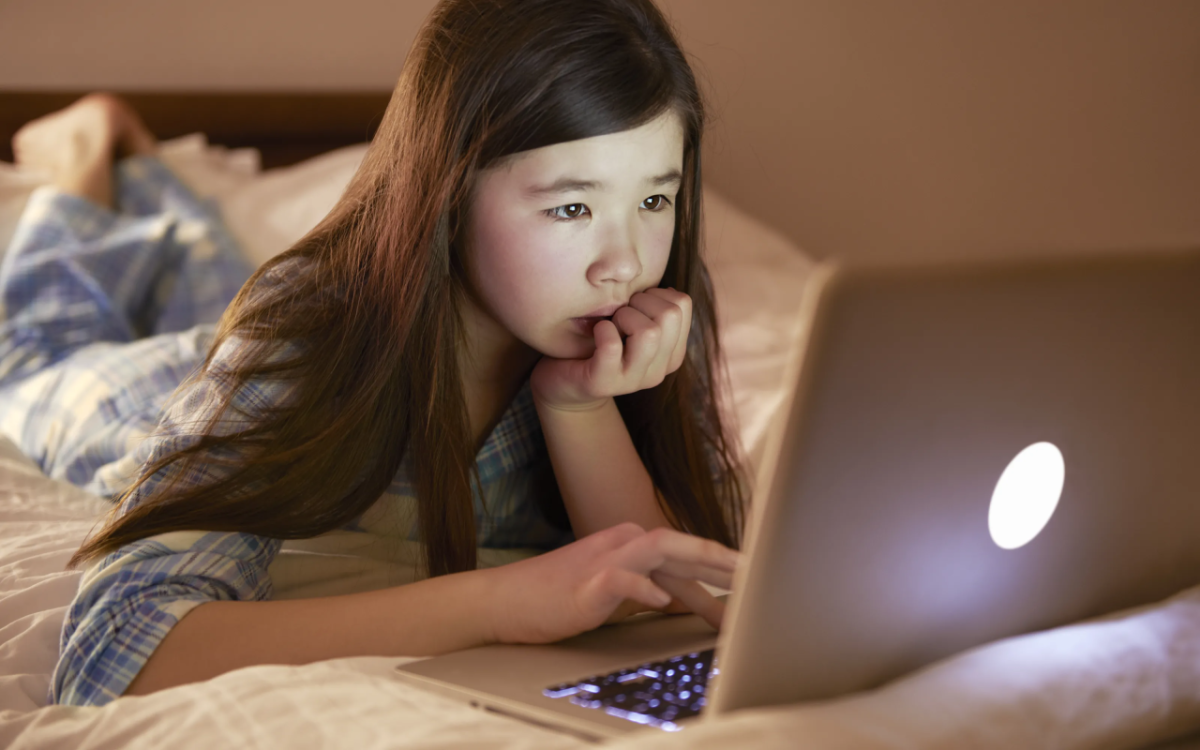 child looking at laptop computer screen