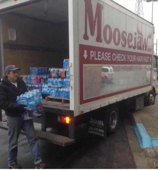 Moosejaw truck being loaded up with water to distribute to shelters.
