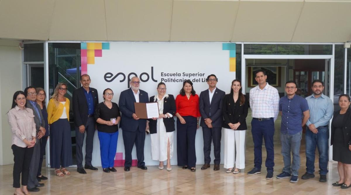 Representatives from DP World and ESPOL pose for a group photo following the signing of a partnership agreement to monitor marine biodiversity at the Port of Posorja.