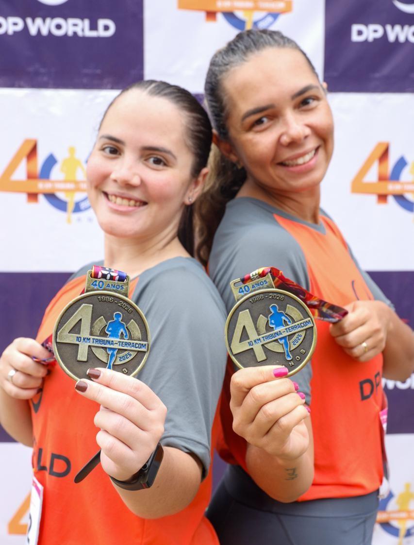 Two DP World employees display their medals after completing the 40th edition of the 10KM Tribuna FM Race in Santos, Brazil.
