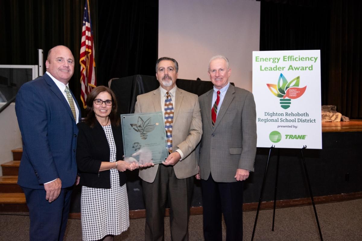 The Dighton-Rehoboth Regional School District received the Energy Efficiency Leader Award from Trane in recognition of the district’s commitment to providing a healthy, productive learning environment with minimal impact on the environment. Shown here (from left) are Kevin Colbert, vice president for Trane, Eliza Coutour, school committee chairwoman, Anthony Azar, DRRSD Superintendent, and Leo McNeil, regional director comprehensive solutions for Trane.
