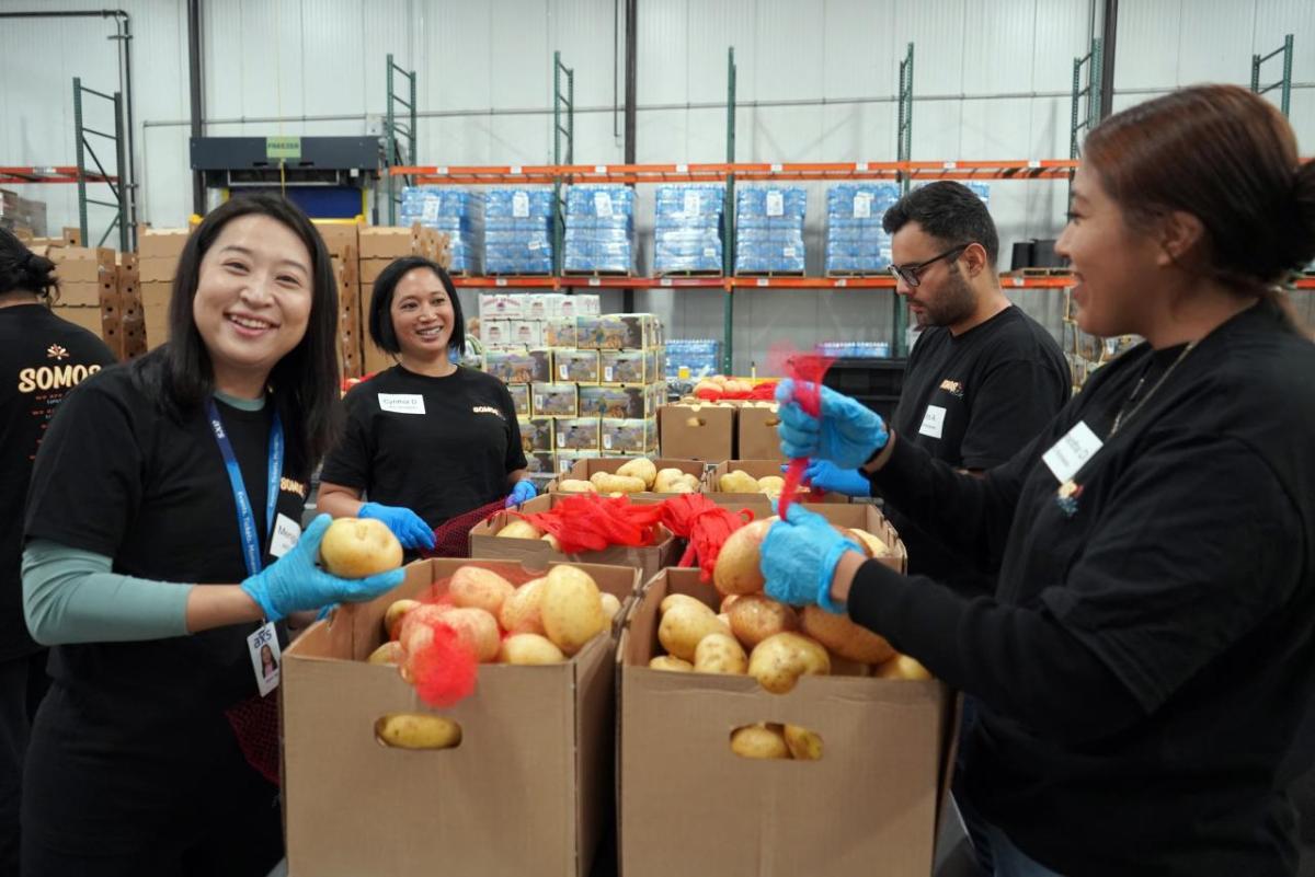 Volunteers assembled five-pound bags of fruits and vegetables.