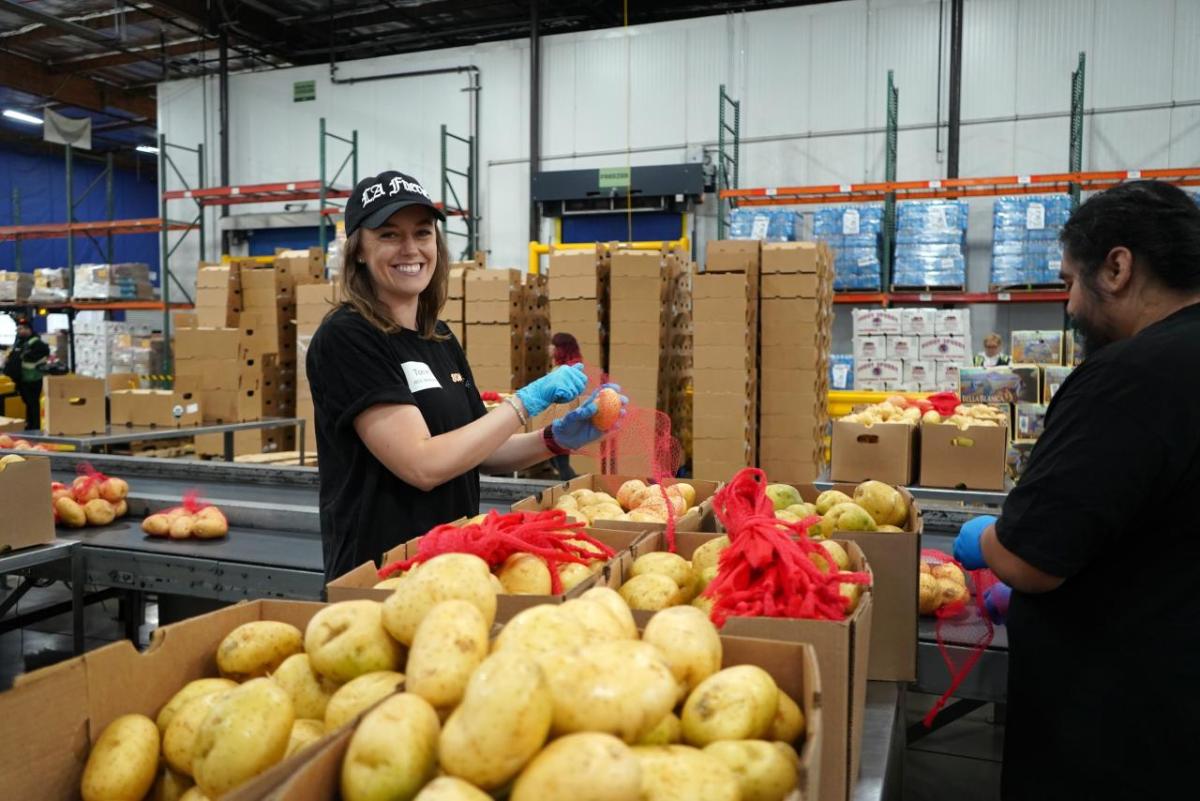 AEG volunteers spent the day sorting and packing fresh produce for distribution across the county.