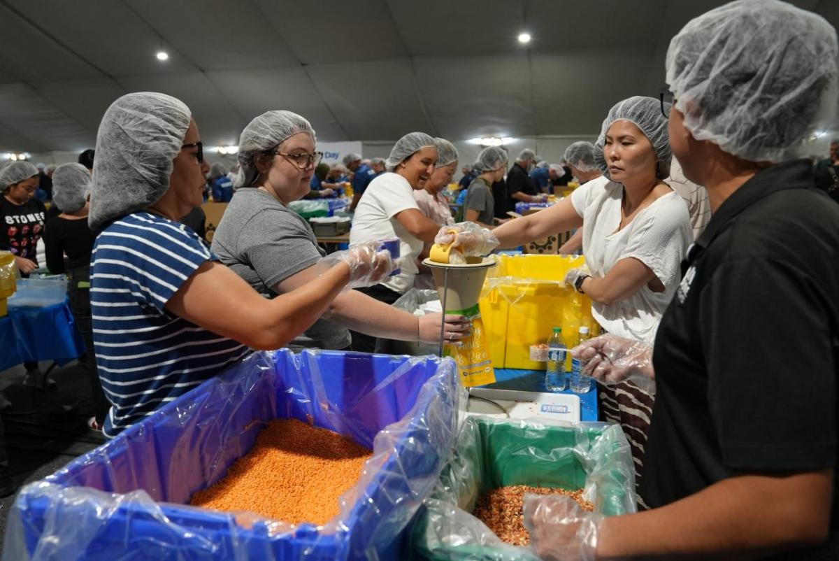 AEG employees volunteered their time to help pack meals on 9/11 Day.