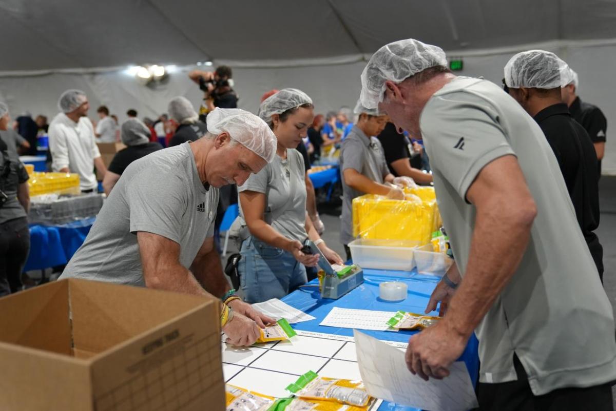 LA Kings Darryl Evans joins volunteers to pack meals on 9/11 Day at L.A. LIVE.