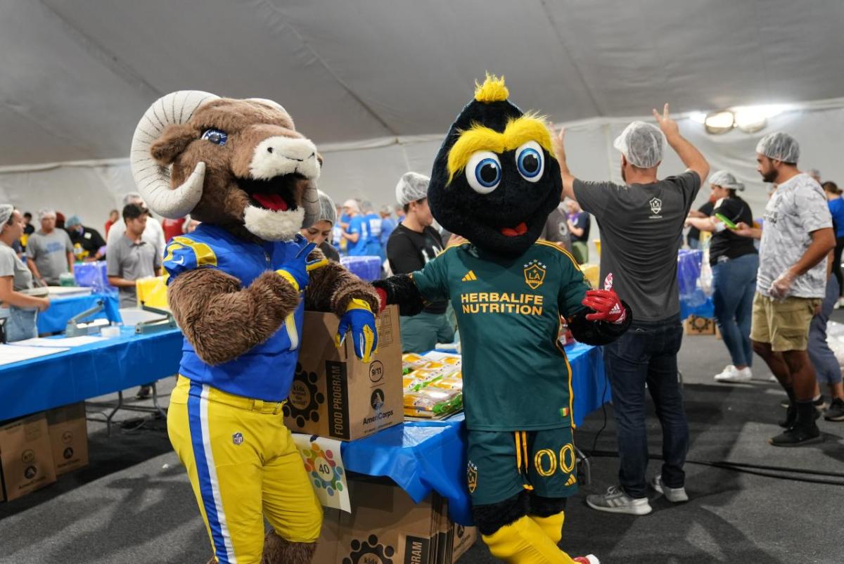 LA Galaxy's mascot Cozmo joins LA Ram's mascot Rampage at the 9/11 Day LA Meal Pack.