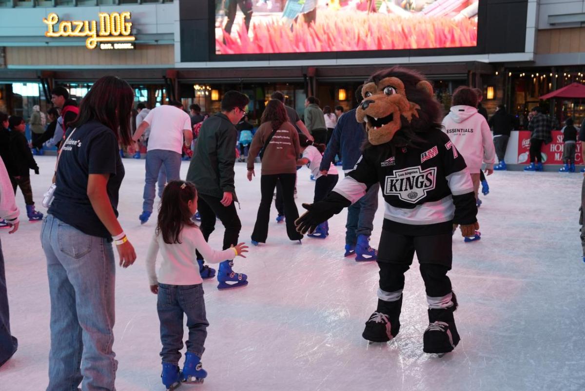 LA Kings mascot Bailey helped children skate at the LA Kings Holiday Ice rink during a community holiday celebration.