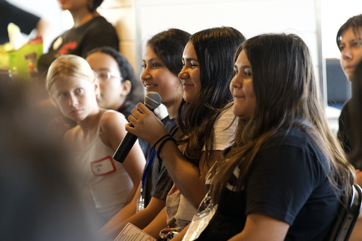 Girls Inc. of Los Angeles participant asks a question during an interactive discussion session focused on leadership, personal growth, and career exploration.