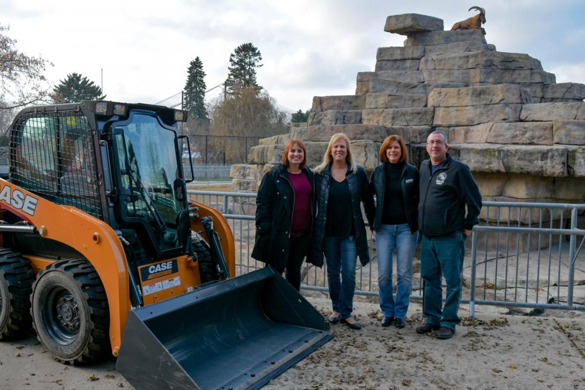 CNH Industrial’s Bonnie Sikora (far left) and Debbie Townsley (second right) handed over the Skid Steer to Beth Heidorn (second left) and Dave Williams (far right) from the Racine Zoo.