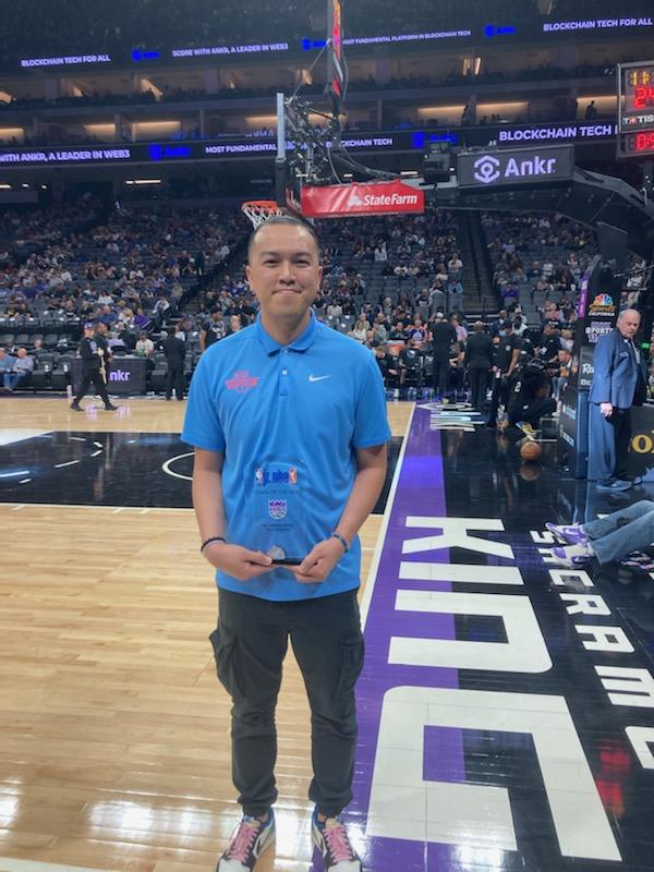 Tom Tran pictured on the sidelines at a game. 
