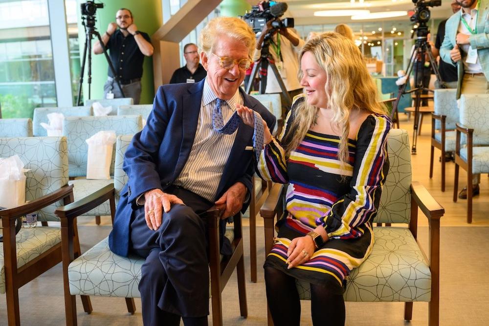 Dan and Elaina shown as older people. Elaina is holding Dan's tie as she did when she was a child.