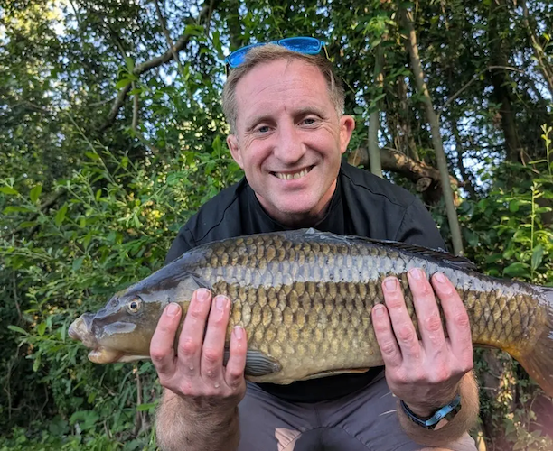 Daniel with a fish that he caught.