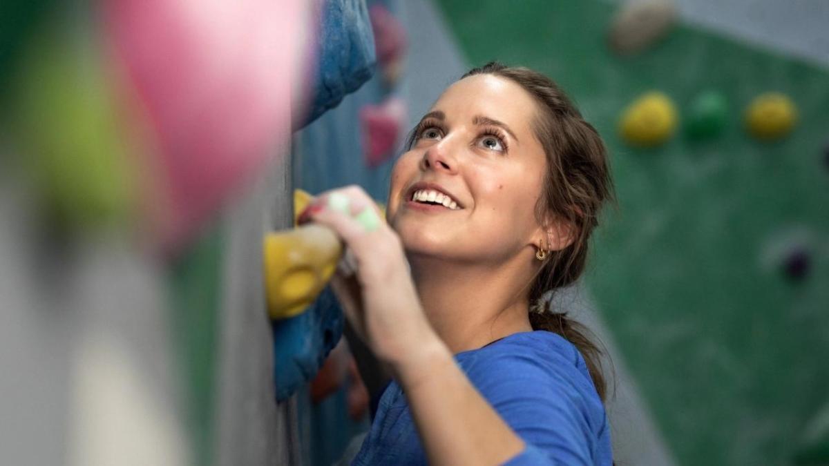 Alexandra Toth climbing a rock wall
