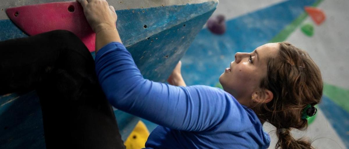 Alexandra Toth climbing a rock wall