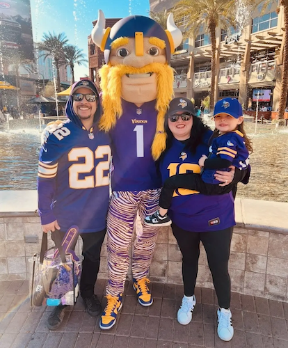 Dina at a football game with her family.