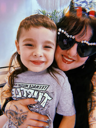 Dina with her child.