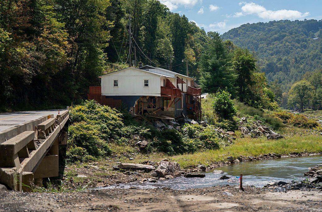 Photo by Allison Joyce/Getty Images Photo of a house on a riverbank.