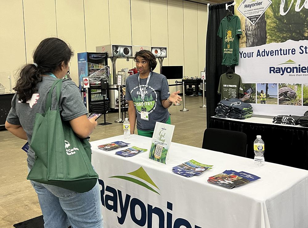 Ebony talking to a student at the SAF Conference