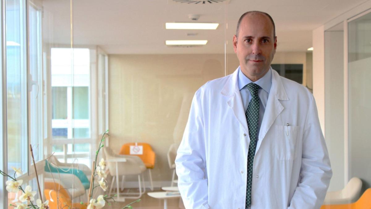 Dr. Javier Cortes standing outside a waiting room.