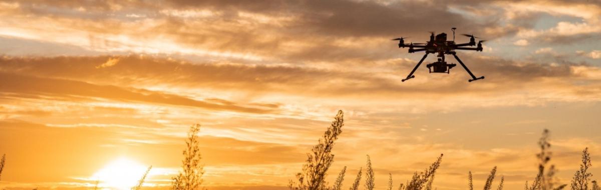 drone in the sky at sunset