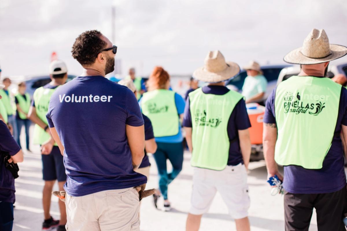 A group of volunteers walking away from the camera