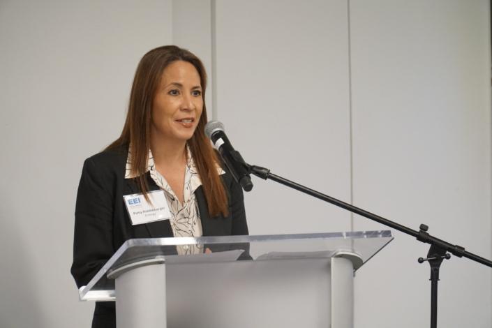 Woman speaking at a lectern