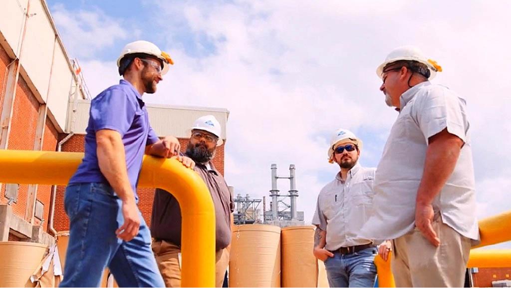 Four factory workers talk