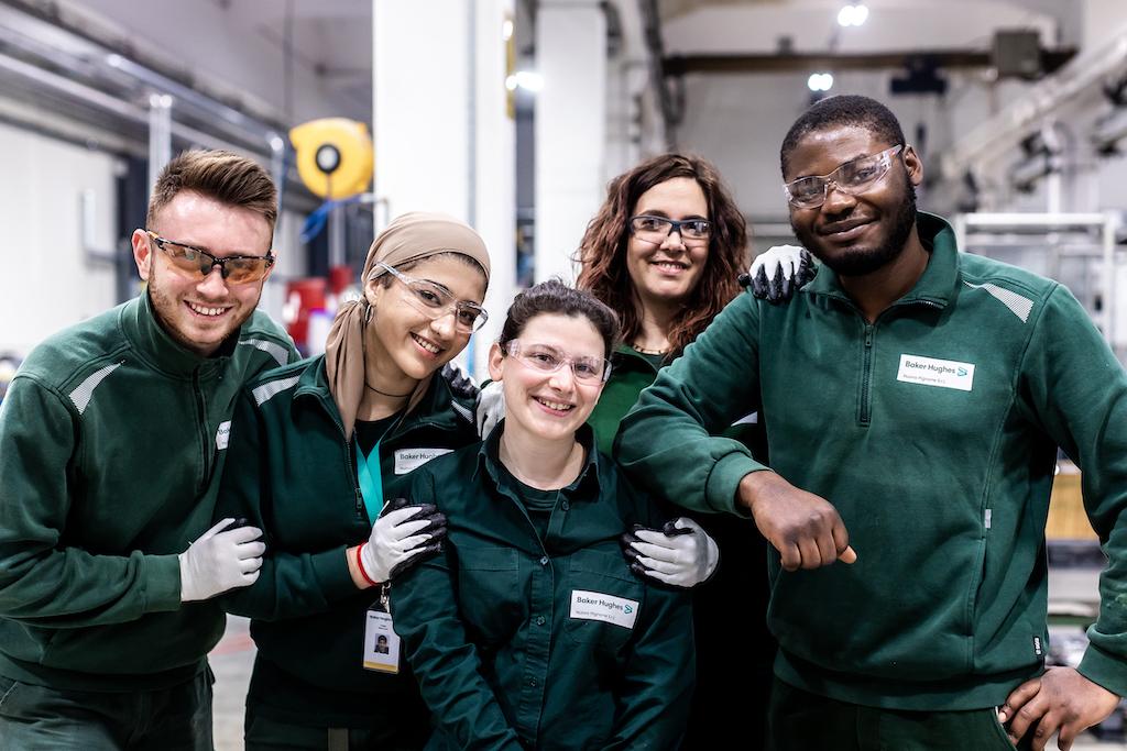 group of Baker Hughes employees posing together