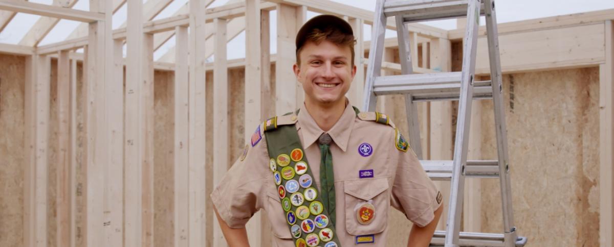 Boy Scout Tim Maron stands inside the tiny home being built for a homeless military veteran. His two-year project is nearly finished.
