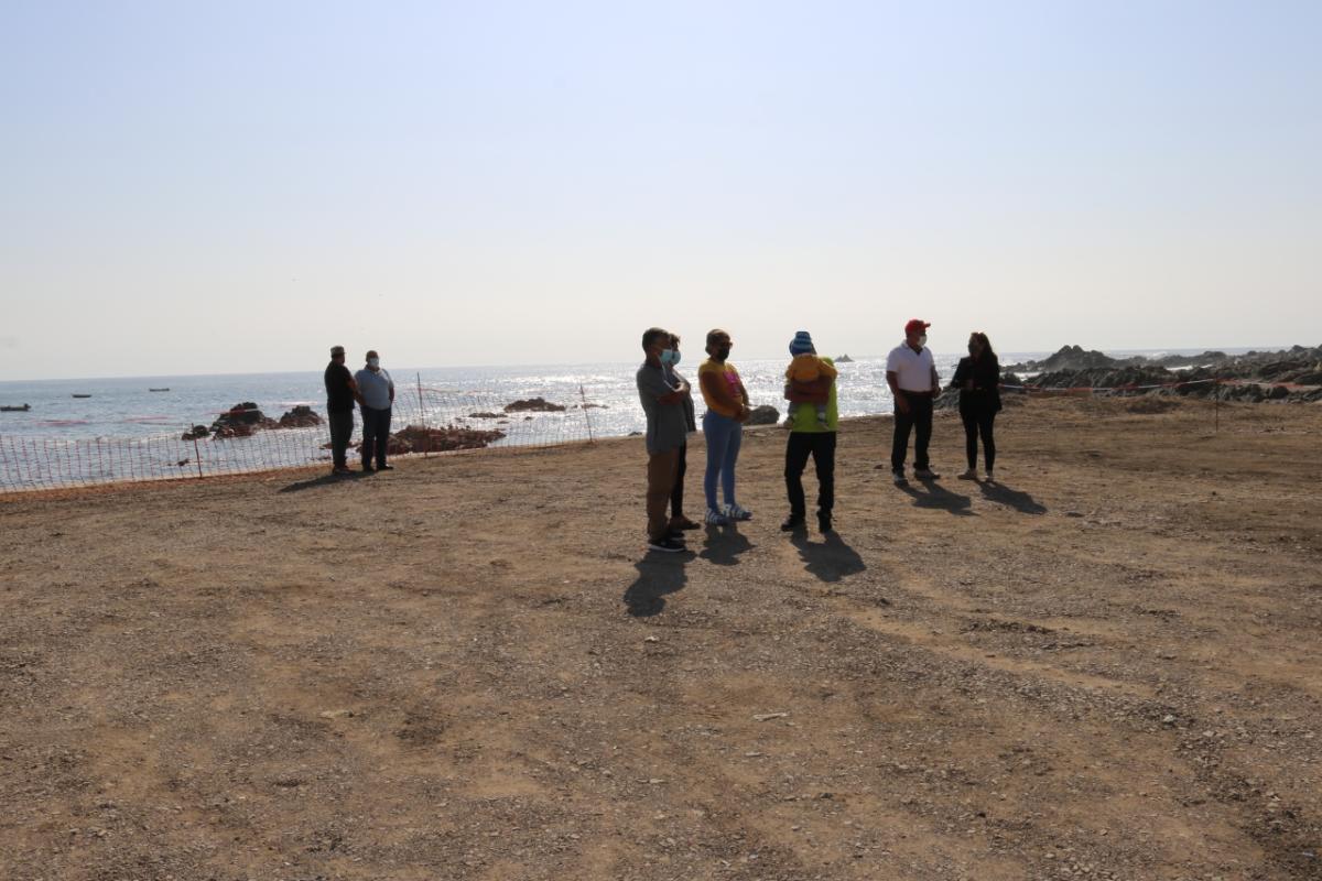 people standing on a beach