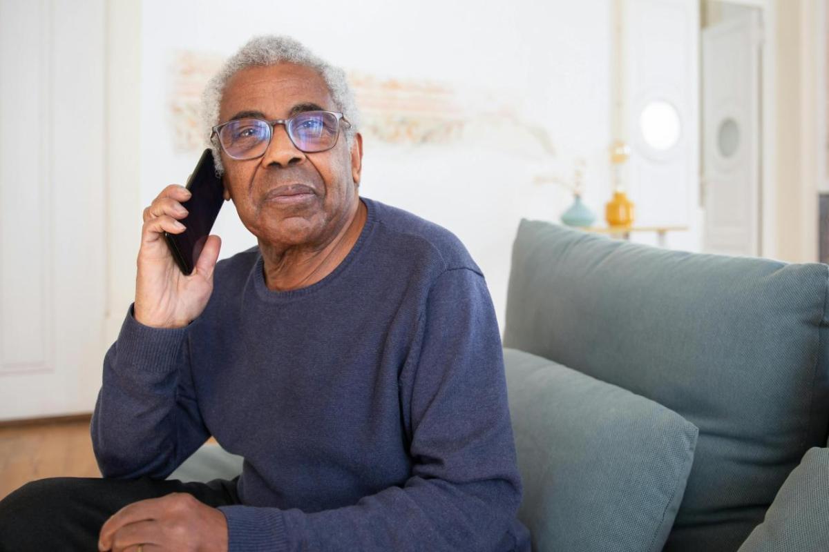 Older gentleman on the phone.