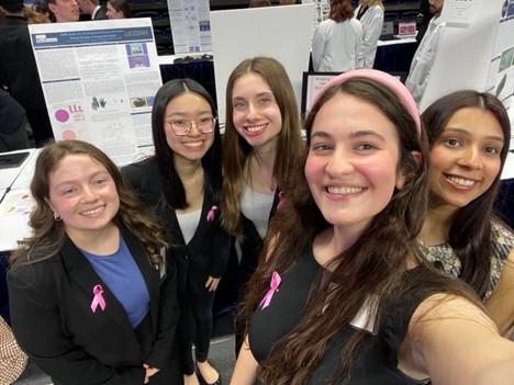 Emily Jacobs, far left, of Medtronic, with the group of young innovators.