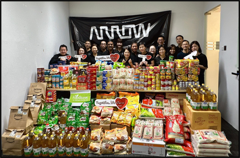 Arrow employees helping at a food bank in Singapore