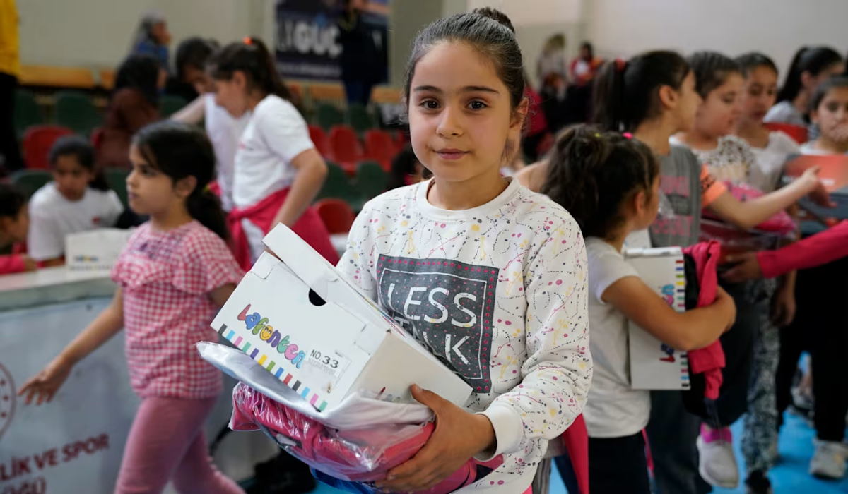 Student with shoe box
