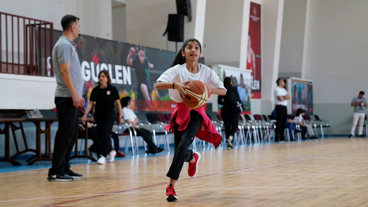 Student with a basketball