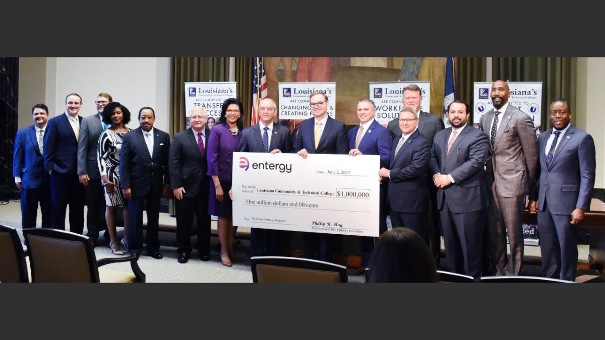 Entergy Group holding large check